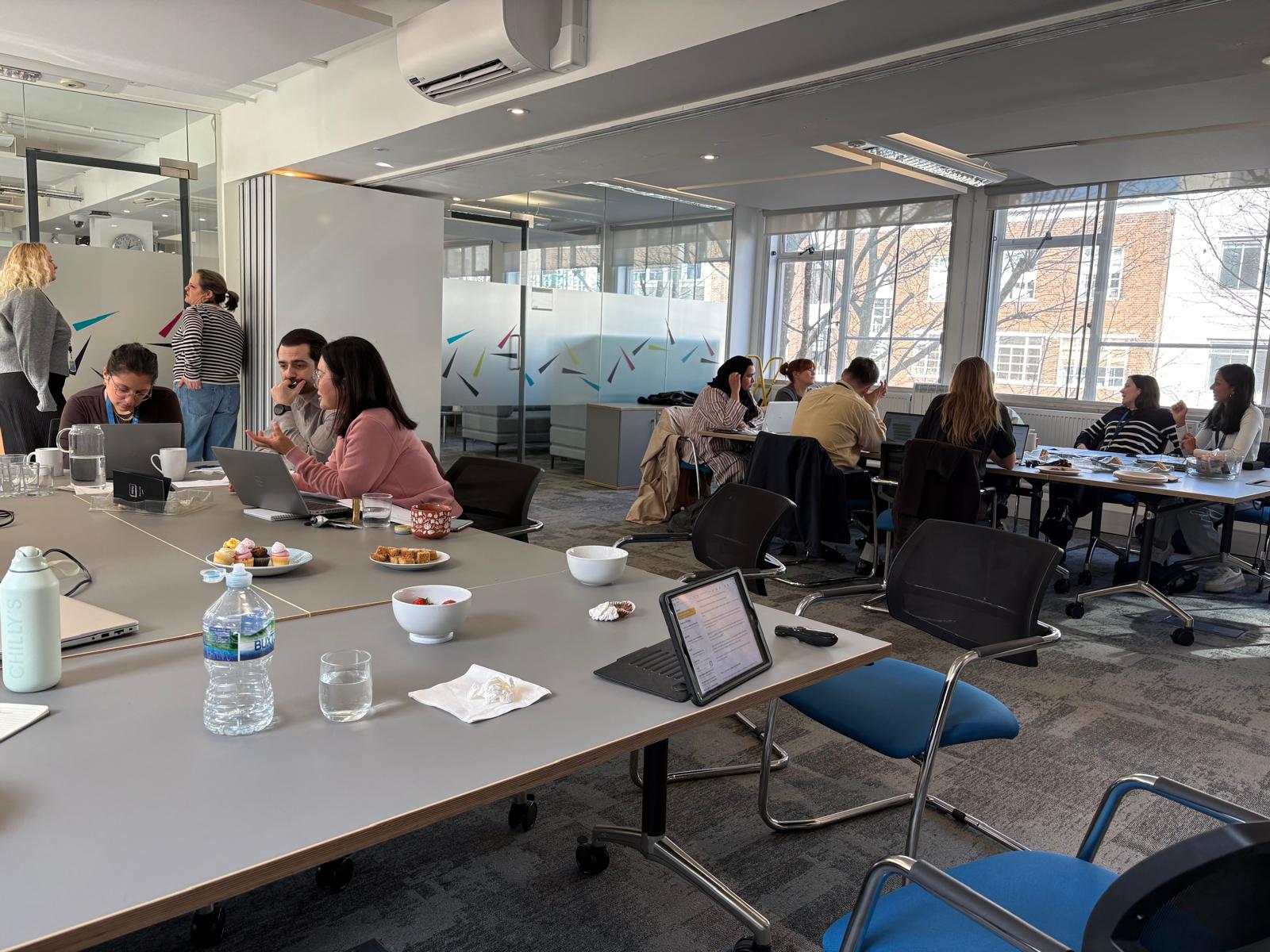 UCL participants discussing workshop activities during a Clemorton engagement